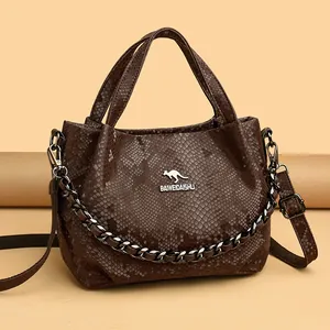 Fashionable dark brown snake skin embossed bucket bag with metal chain and top handles