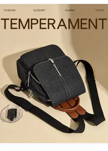 Detail of grey denim backpack with black canvas straps and brown leather handle