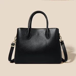 Classic black leather tote bag with lychee texture and adjustable shoulder strap