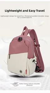 Detail of padded shoulder straps and contrast stitching on lightweight pink backpack