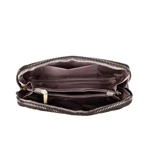Internal view of brown leather peony clutch showing card slots and center zipper pocket