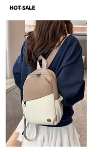Rear view of khaki and cream contrast shoulder bag with functional zipper pockets