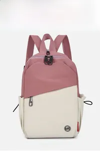 Front detail of pink and off-white contrast backpack with metallic LST brand logo