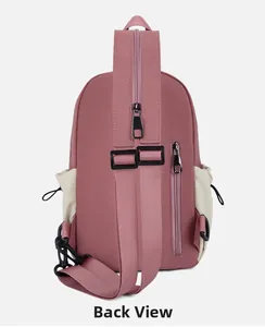 Detail view of pink sling bag back with adjustable strap and hidden vertical zipper pocket