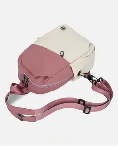 Detail of color-block sling bag featuring waterproof nylon fabric and multi-layer zippers