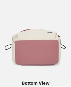 Detailed bottom view of the two-tone nylon backpack showing fabric texture and seams