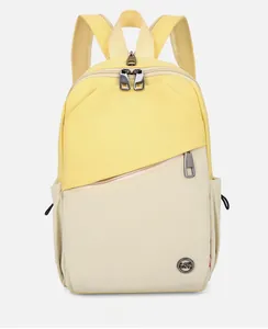 Front detail of contrast yellow and beige nylon backpack with multi-pocket and metal logo