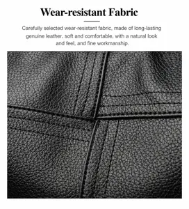 Detalle de bolso tote en cuero negro con textura de grano y costuras cruzadas