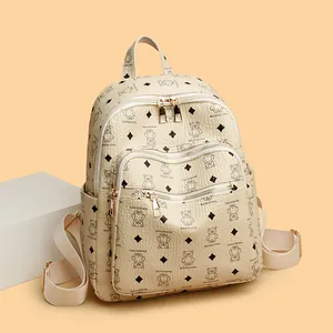 Fashionable beige bear print backpack for women in textured faux leather style