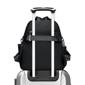 Sac à dos noir en nylon avec sangle de bagage et poche arrière antivol pour voyage