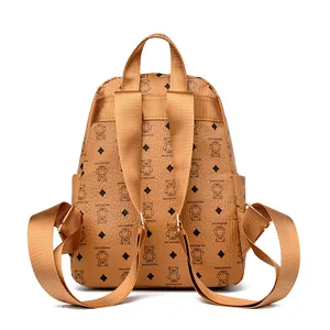 Brown faux leather backpack featuring black bear print and adjustable straps