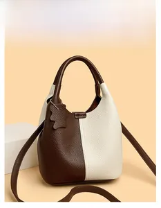 Detail of lychee pattern leather and two-tone color stitching on the bucket bag