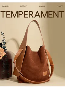 Detail of brown suede bucket bag featuring high-quality texture and leather stitching