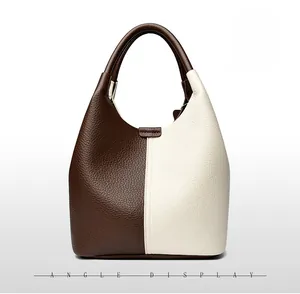Rear view of contrast-color leather tote bag showing high-quality lychee texture and back angle