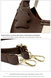 Close-up of leather bucket bag with bear charm and golden lobster clasp detail