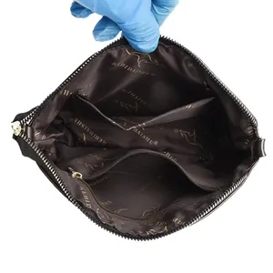 Structure interne du sac vintage gaufré lotus avec doublure brune et poches
