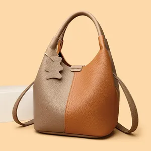 Litchi pattern leather bucket bag in beige and caramel with cute bear charm