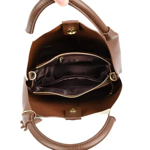 Dark brown leather bucket bag with multiple interior compartments and gold hardware