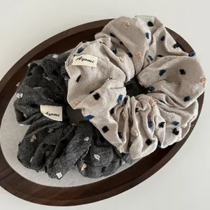 Set of 2 oversized scrunchies with colorful dot embroidery in dark grey and beige colors
