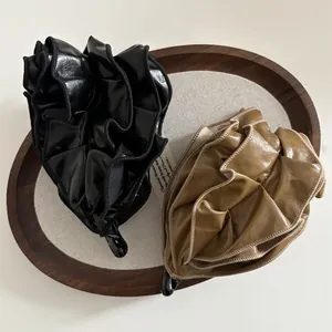 Faux leather pleated banana hair clips in black and olive green for elegant ponytails