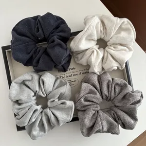 Morandi colors knitted striped scrunchie set in gray and beige tones on a tray