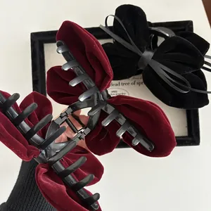 Large velvet bow hair clips in wine red and black colors for thick hair