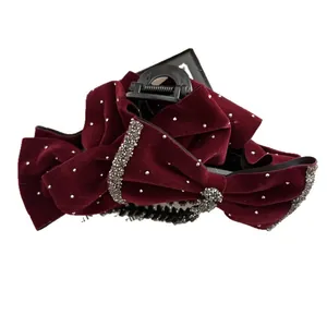 Elegant deep red velvet bow hair claw clip with sparkling rhinestones for hair styling
