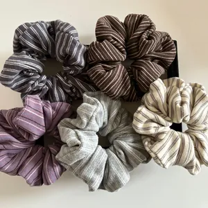 5-piece set of striped knitted scrunchies in grey coffee and beige colors for ponytails