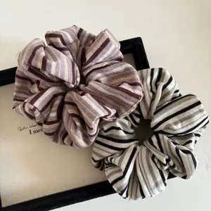 Retro striped knitted scrunchies set in purple and grey with soft elastic texture