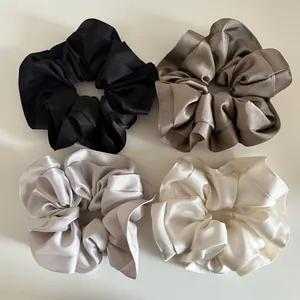 Set of 4 oversized satin scrunchies in neutral cream, black, grey and coffee tones