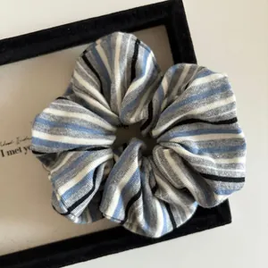 Macro detail of high-elasticity striped knitted fabric on a vintage scrunchie