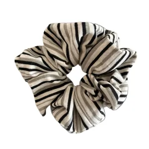 Classic striped knit scrunchie with high elasticity featuring black and white patterns