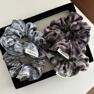 Set of 4 vintage velvet leopard print scrunchies in gray, blue, and purple tones