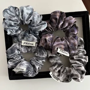 Set of four vintage leopard print velvet scrunchies with soft texture and high elasticity