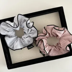 Striped scrunchies set in grey and pink with handmade label for ponytail styling