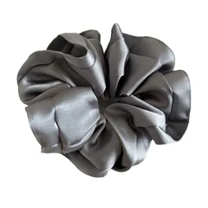 Premium dark grey satin oversized scrunchie with smooth silk texture and rich pleats