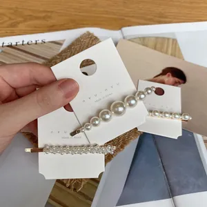 Ensemble de deux barrettes à perles vintage avec élégante finition en métal doré