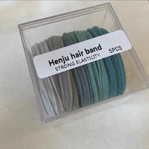 Five Morandi-colored high-elasticity hair bands in a clear plastic storage box