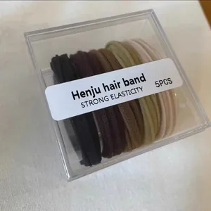 Close-up of 5-piece high-elasticity hair band set in a clear plastic storage box