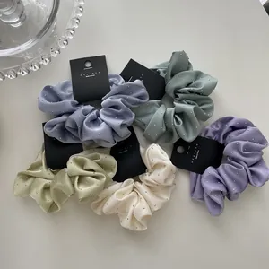 Five-piece set of satin scrunchies with studded rhinestones in soft pastel colors