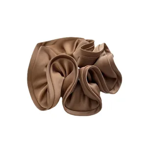 Oversized deep coffee brown satin scrunchie with layered ruffle pleats and smooth silk texture