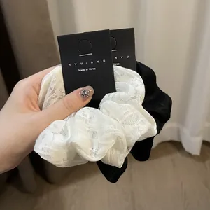 Elegant hollow lace crochet hair scrunchies set in black velvet and white lace textures