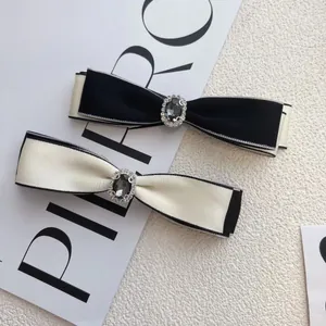 Elegant rhinestone bow hair clip set in black and white contrast for luxury hair styling
