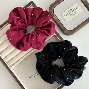 Elegant velvet hair scrunchies in black and burgundy with sparkly rhinestone polka dots