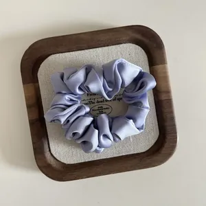 Elegant lavender silk satin scrunchie with premium pleated texture for women