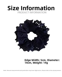 Close-up of black layered lace scrunchie showing detailed embroidery and scalloped edges