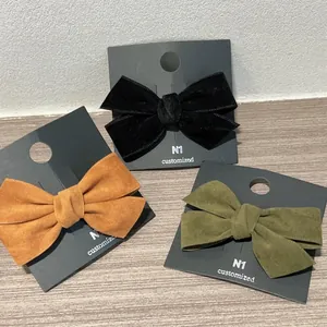 Lot de trois barrettes nœuds en velours couleurs noir, orange gingembre et vert