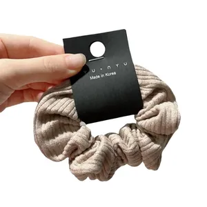 French style striped knit scrunchie in beige velvet texture with modern minimal design