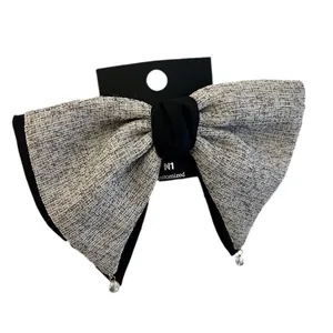 Nœud papillon à cheveux en tweed gris avec pendentifs en cristal et nœud central noir