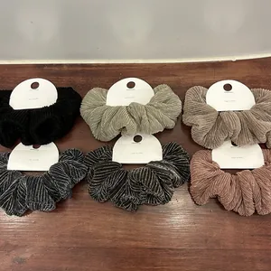 Set of 6 metallic pleated scrunchies in various colors with a shiny textured finish